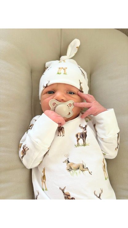 Newborn hat featuring a whimsical little fawn and big yawn deer print on soft fabric