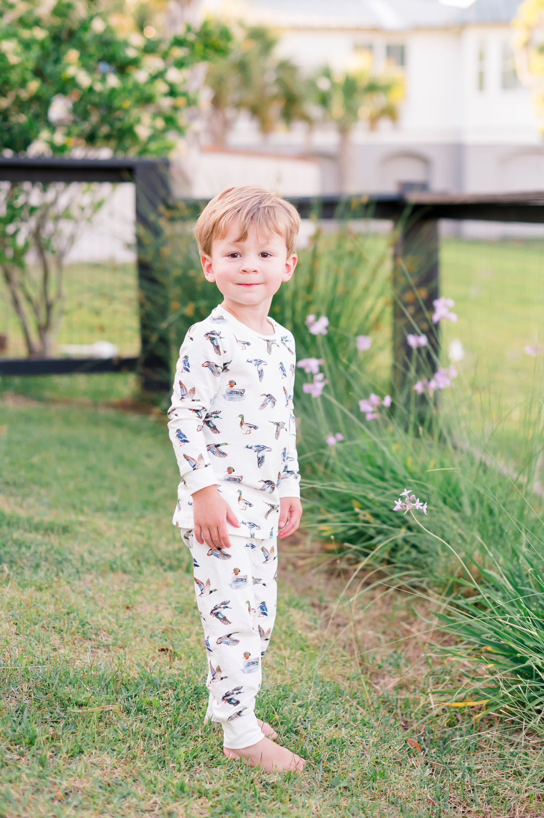 Two-piece duck print pajama set for kids made from soft, breathable fabric.