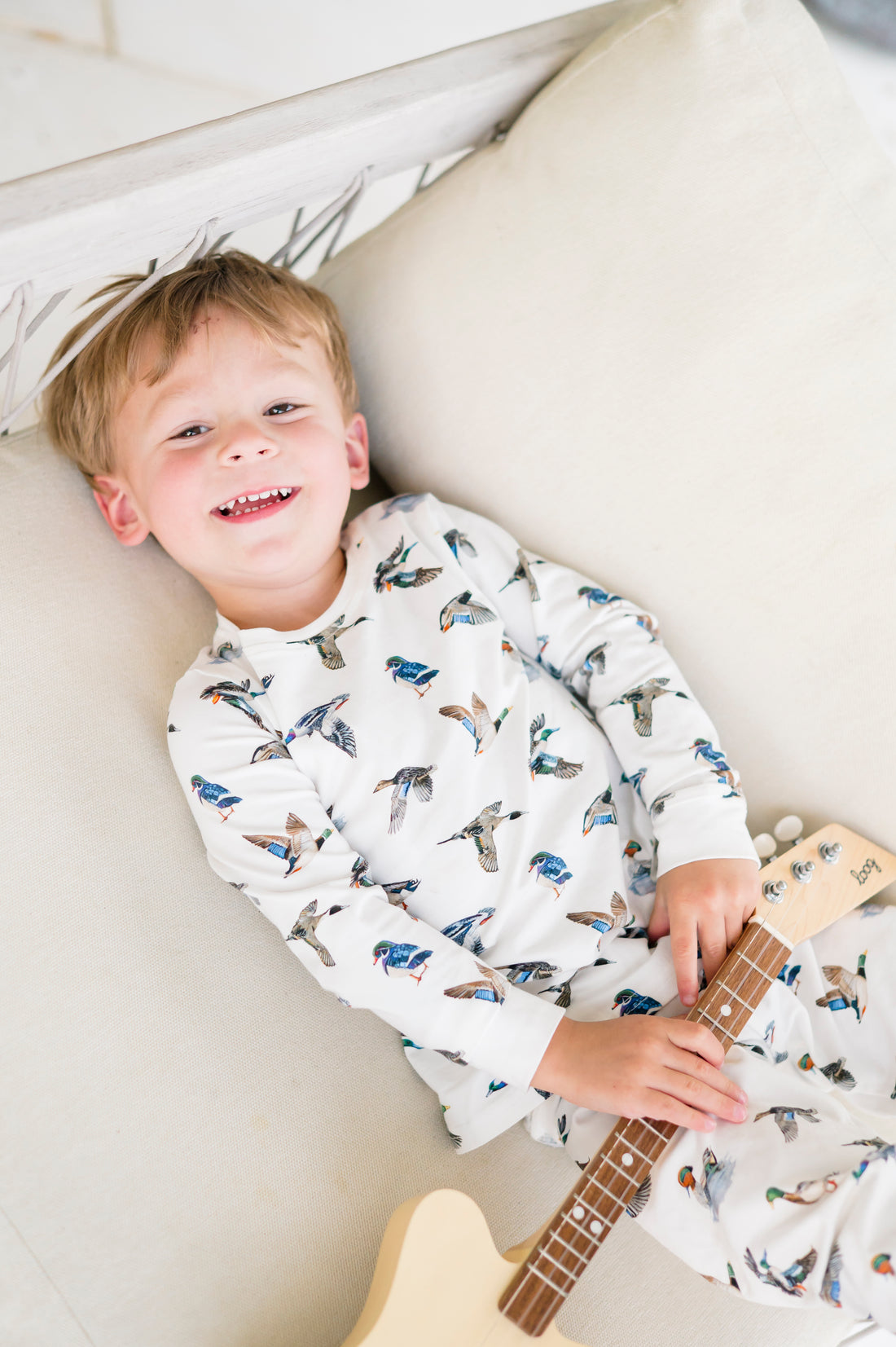Two-piece duck print pajama set for kids made from soft, breathable fabric.