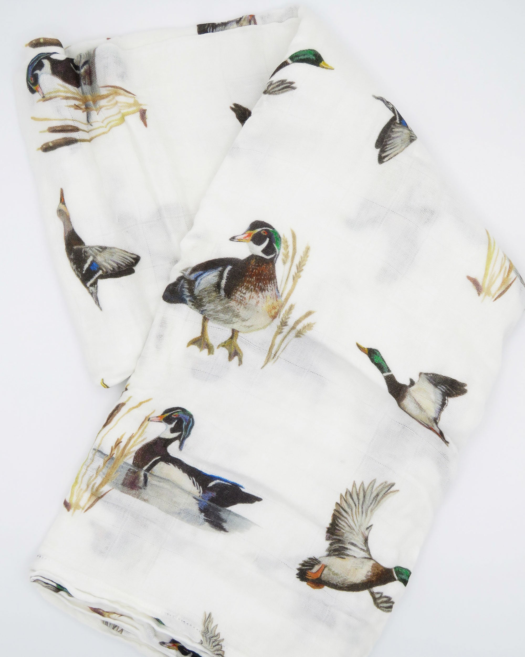 Vibrant pattern of diving ducks on a soft swaddle, perfect for wrapping newborns in style and comfort
