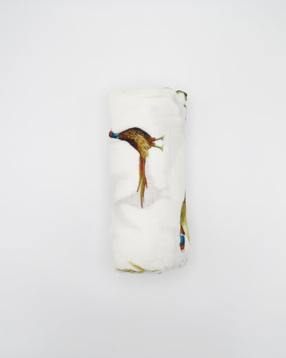 Pheasant and Quail Print Baby Swaddle – Vibrant nature-inspired design made from organic white cotton and bamboo, cozy and soft, rolled and displayed flat on a white background.