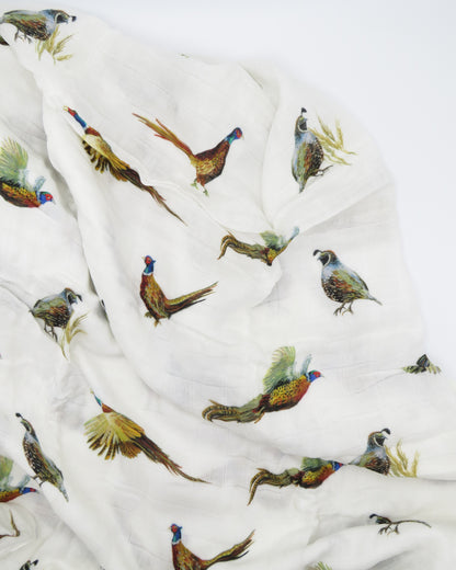  Pheasant and Quail Print Baby Swaddle – Vibrant nature-inspired design made from organic white cotton and bamboo, cozy and soft, displayed flat on a white background.