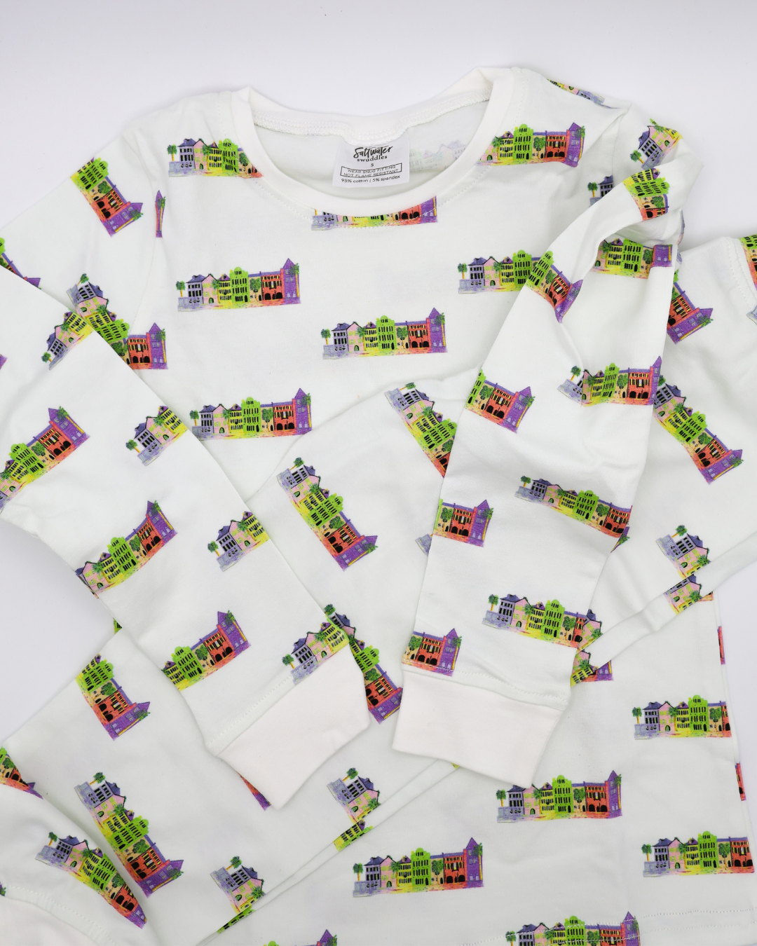 Soft Rainbow Row pajamas displayed flat  and folded on a white background.