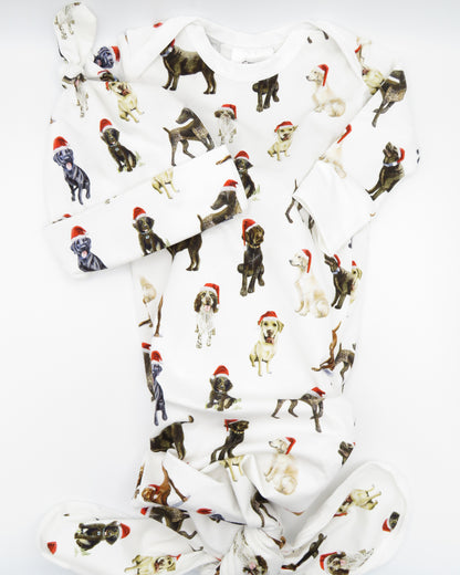 Comfy newborn gown and hat set featuring cute Santa dog prints, perfect for baby’s first Christmas