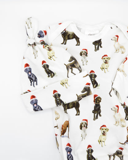 Comfy newborn gown and hat set featuring cute Santa dog prints, perfect for baby’s first Christmas
