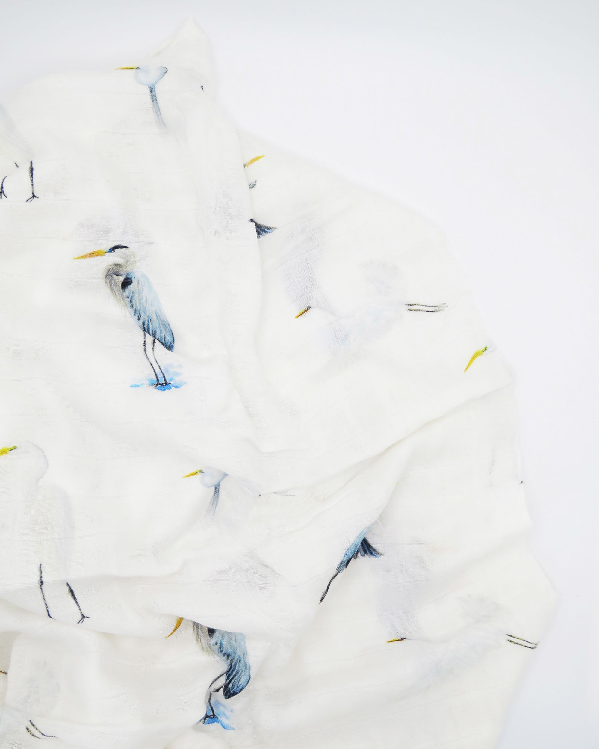 Southern Storks Baby Swaddle Blanket for Newborns. Displayed on a white background. A perfect addition to your hospital bag.