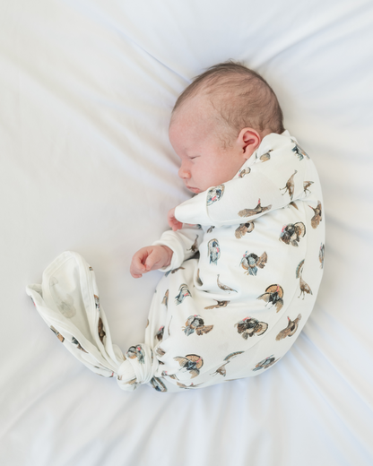 Baby’s early moments in comfy gown and hat set featuring playful turkey design