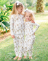 Yellow Labrador print kids pajamas set for bedtime - Sleepwear or loungewear worn by two kids outdoors.