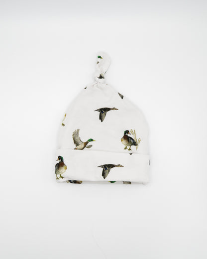 Newborn hat featuring a playful diving ducks print on a soft cotton fabric