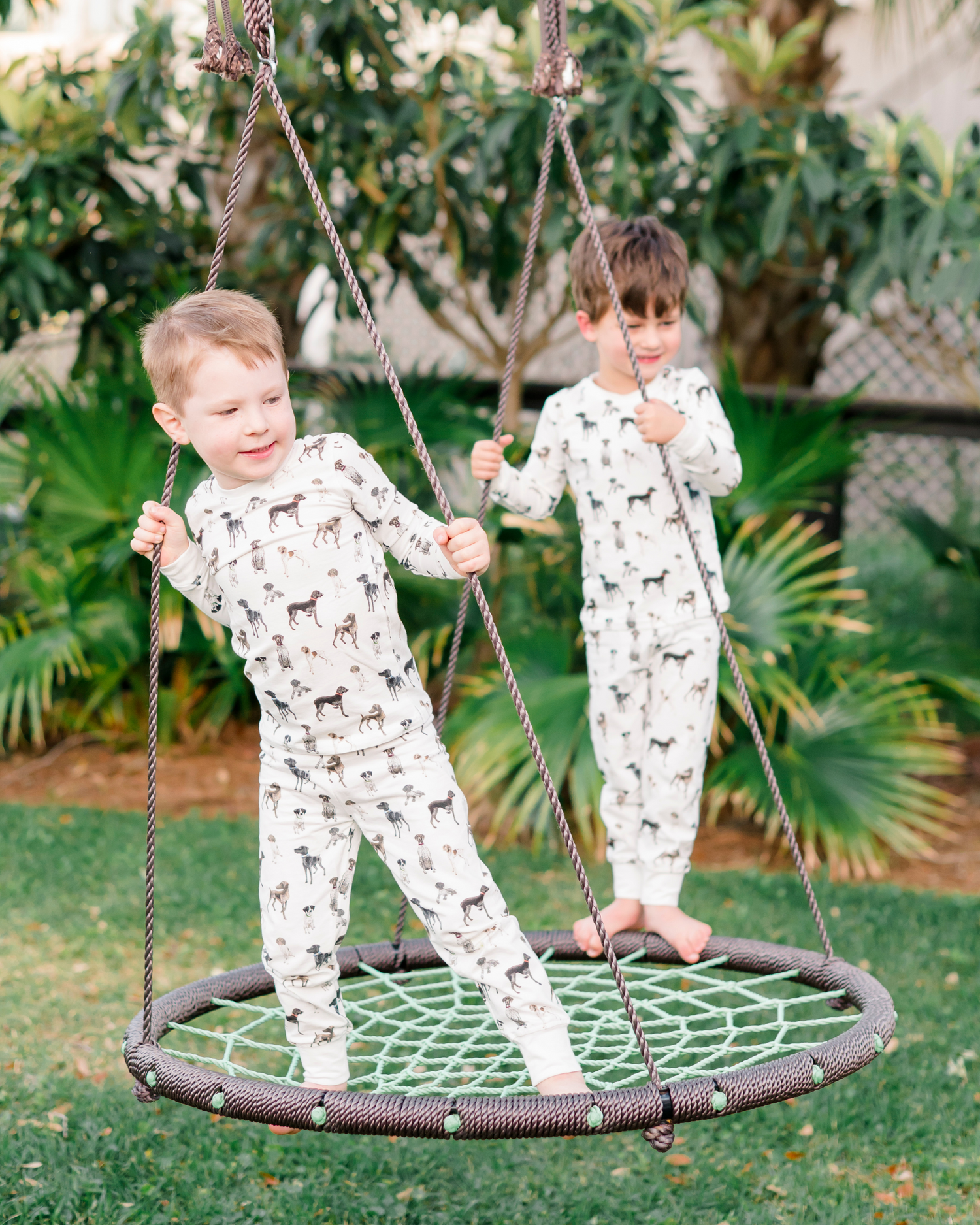 Children wearing comfy kids pajamas with German Shorthaired Pointer printed on soft white fabric