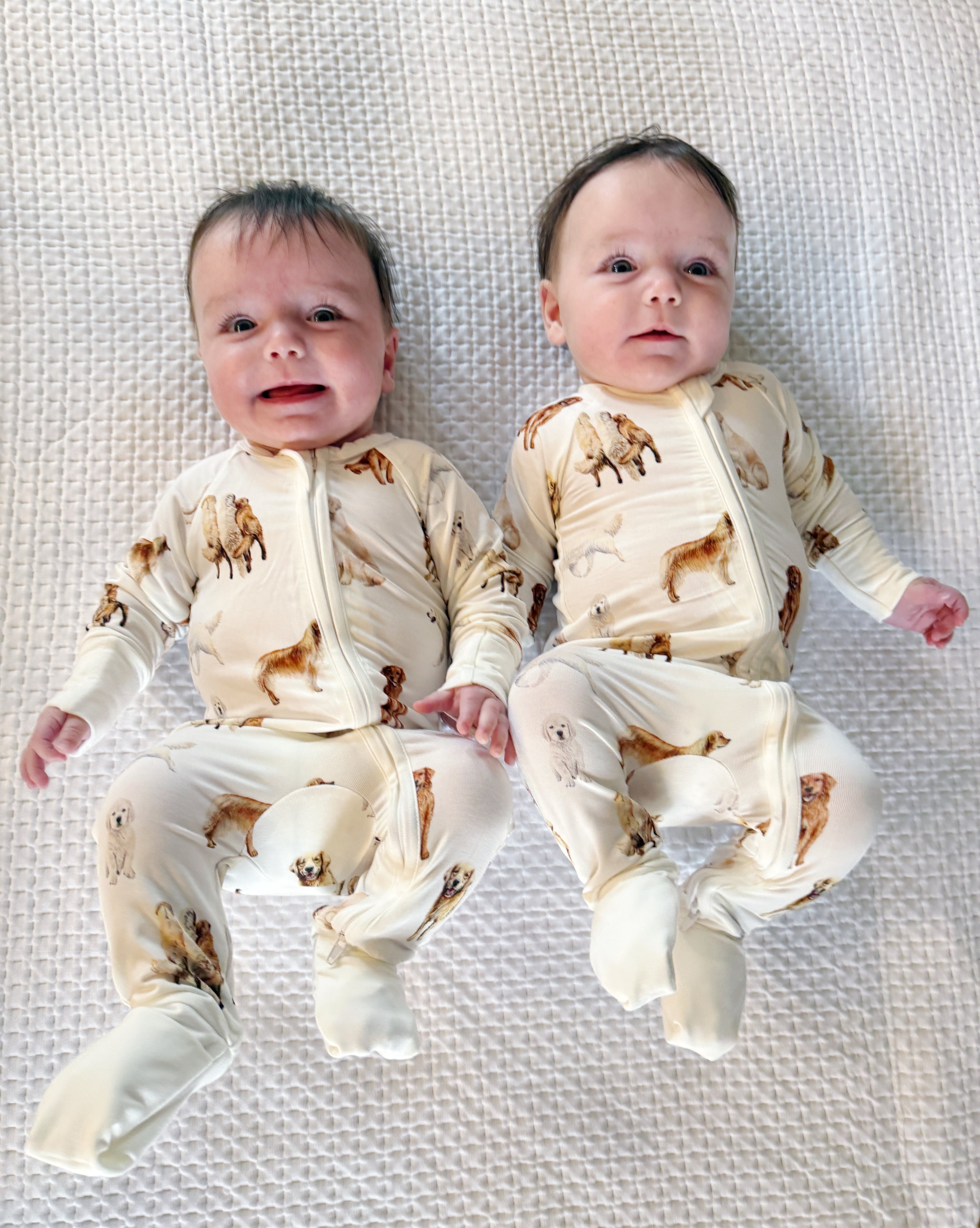 Soft white baby footie pajamas featuring a golden retriever print, with convertible feet designed for comfortable indoor and outdoor wear.
