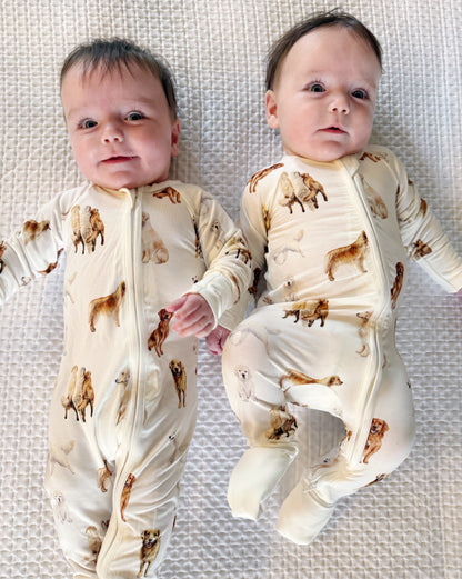 Soft white baby footie pajamas featuring a golden retriever print, with convertible feet designed for comfortable indoor and outdoor wear.