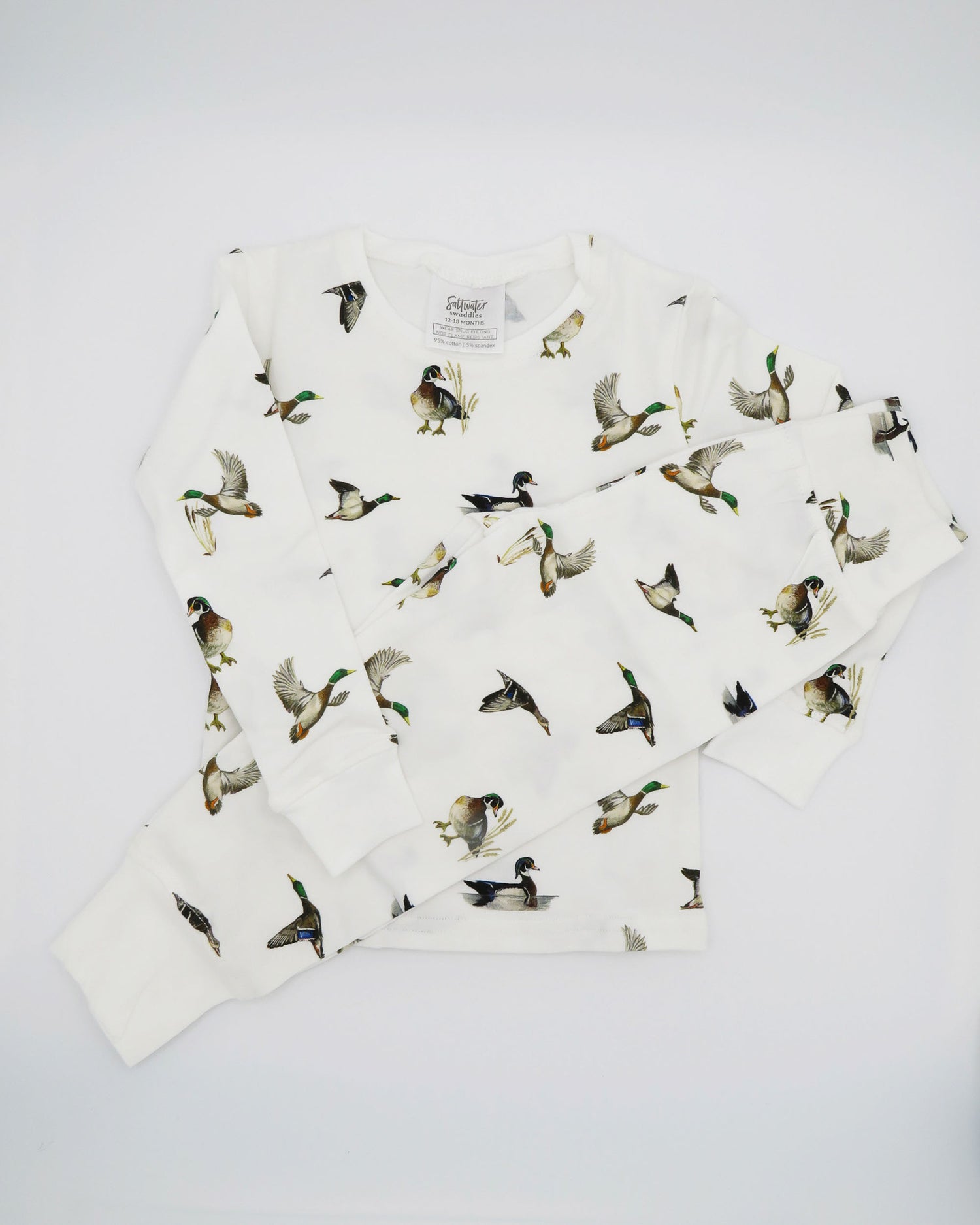 Unisex loungewear or sleepwear featuring a Diving Ducks print on soft white fabric. Kids’ pajamas flat image. Perfect for both indoor and outdoor wear.