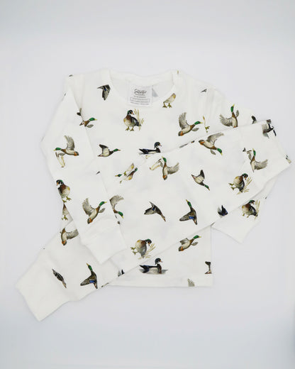 Unisex loungewear or sleepwear featuring a Diving Ducks print on soft white fabric. Kids’ pajamas flat image. Perfect for both indoor and outdoor wear.