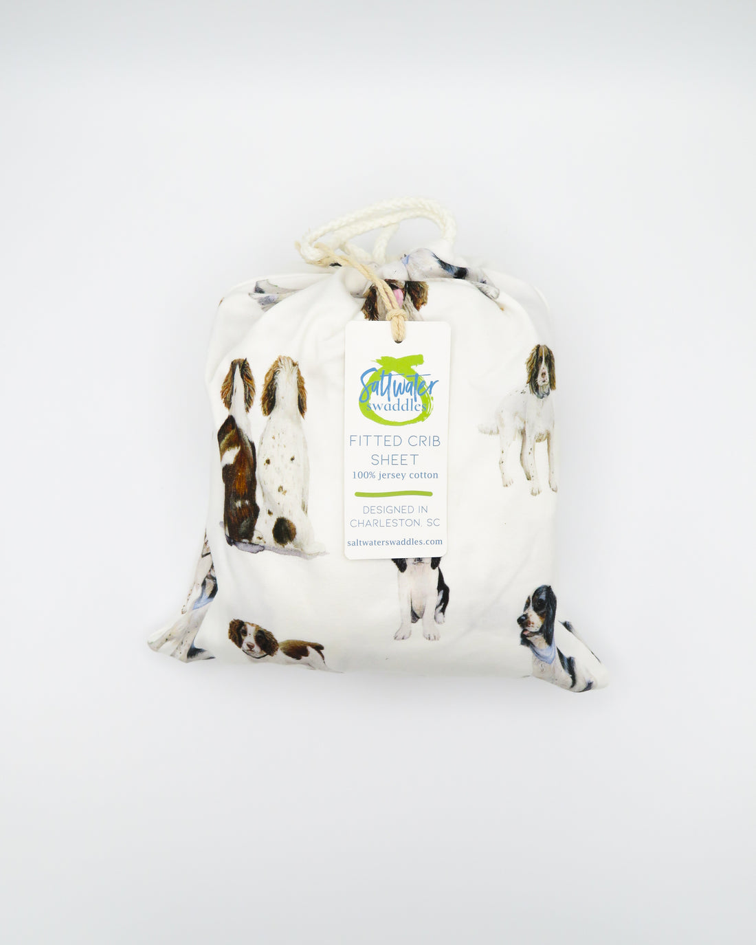 Soft Springer Spaniel print crib sheet for baby nursery. Hypoallergenic and breathable crib bedding. Springer Spaniel dogs printed on soft white fabric.