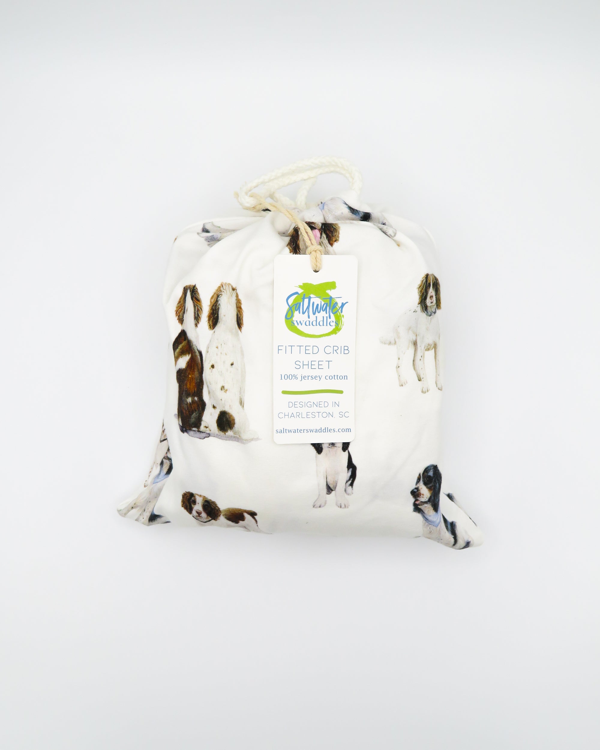 Soft Springer Spaniel print crib sheet for baby nursery. Hypoallergenic and breathable crib bedding. Springer Spaniel dogs printed on soft white fabric.