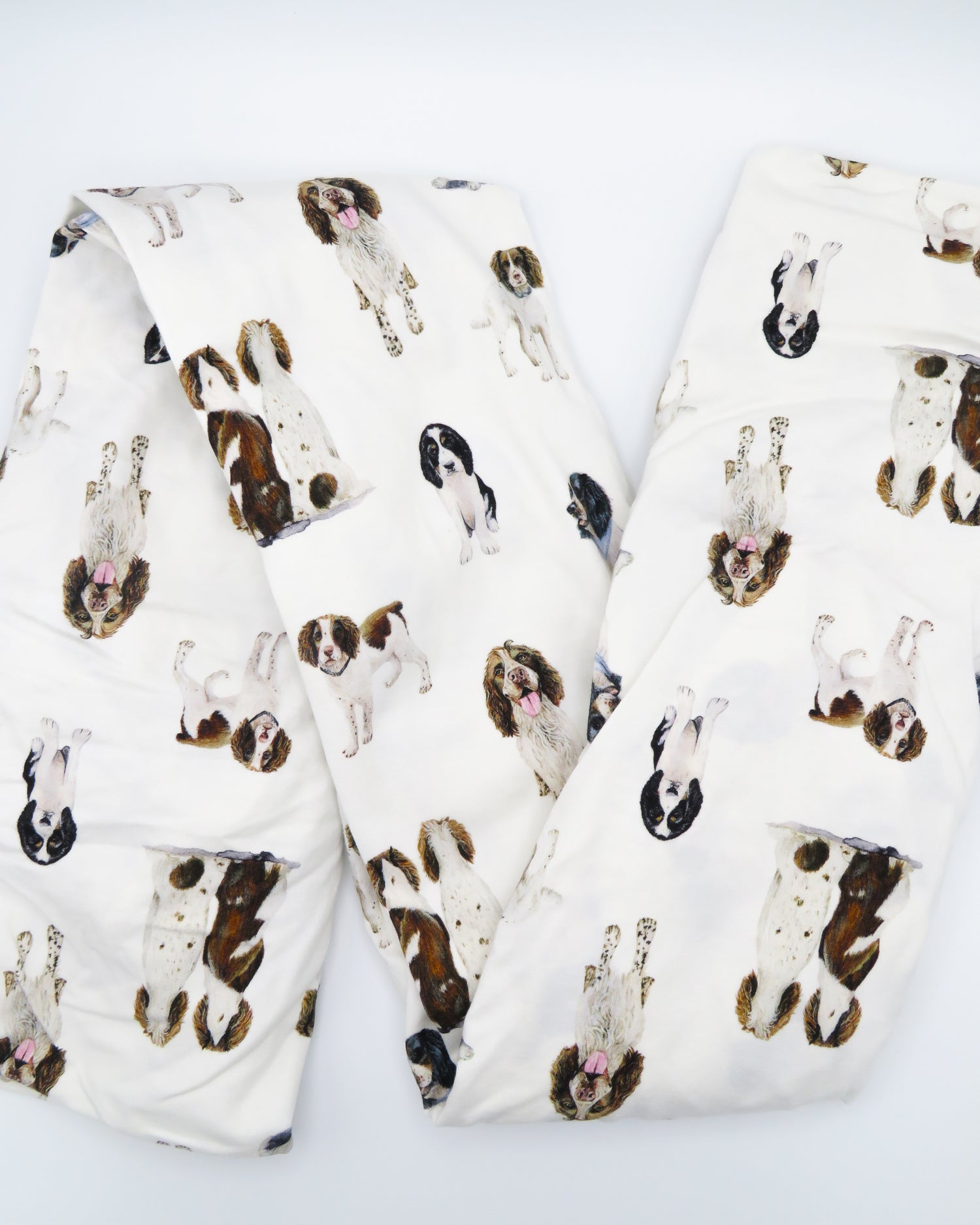 Soft Springer Spaniel print crib sheet for baby nursery. Hypoallergenic and breathable crib bedding. Springer Spaniel dogs printed on soft white fabric.