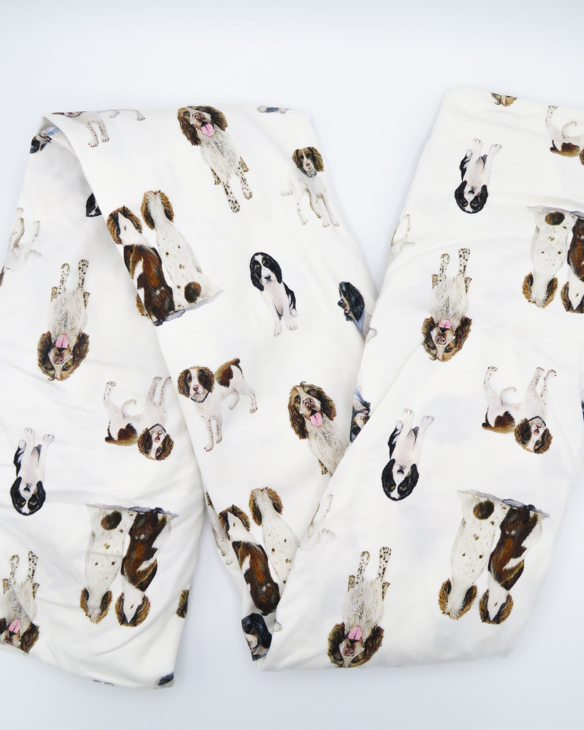 Soft Springer Spaniel print crib sheet for baby nursery. Hypoallergenic and breathable crib bedding. Springer Spaniel dogs printed on soft white fabric.