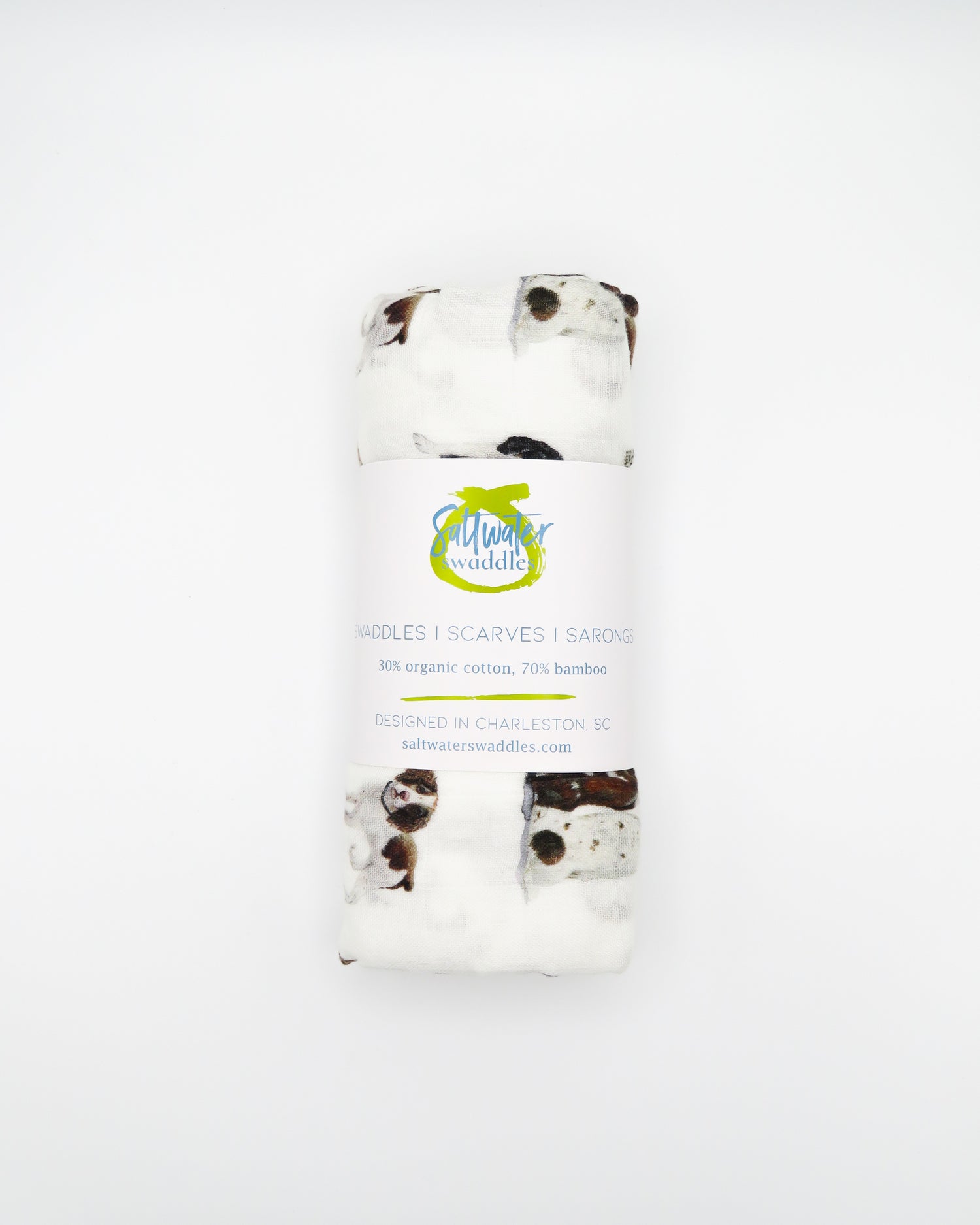 Springer Spaniel print baby swaddle blanket. Gender-neutral dog-themed swaddle for newborns. Springer Spaniel dogs printed on soft white fabric.