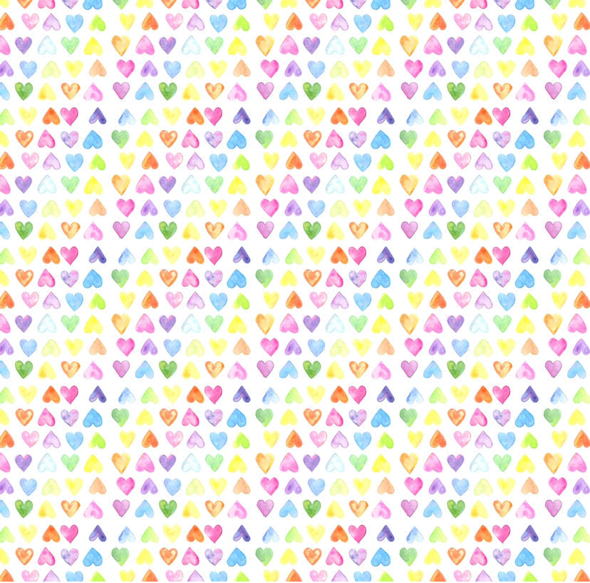 The All My Love Swaddle is displayed flat. A soft baby blanket featuring a rainbow-colored heart pattern.