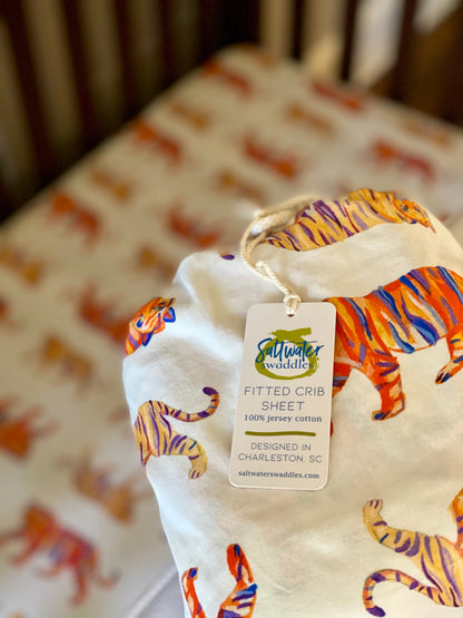 Easy Tiger crib sheet featuring a playful tiger print on soft jersey cotton fabric for baby nurseries.