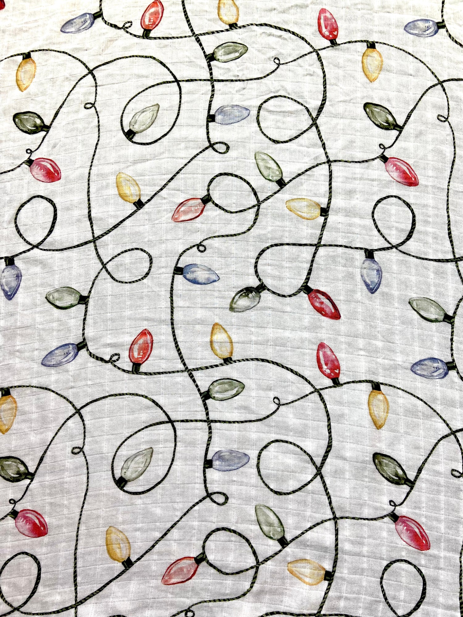 Christmas swaddle with a vintage Christmas lights pattern.